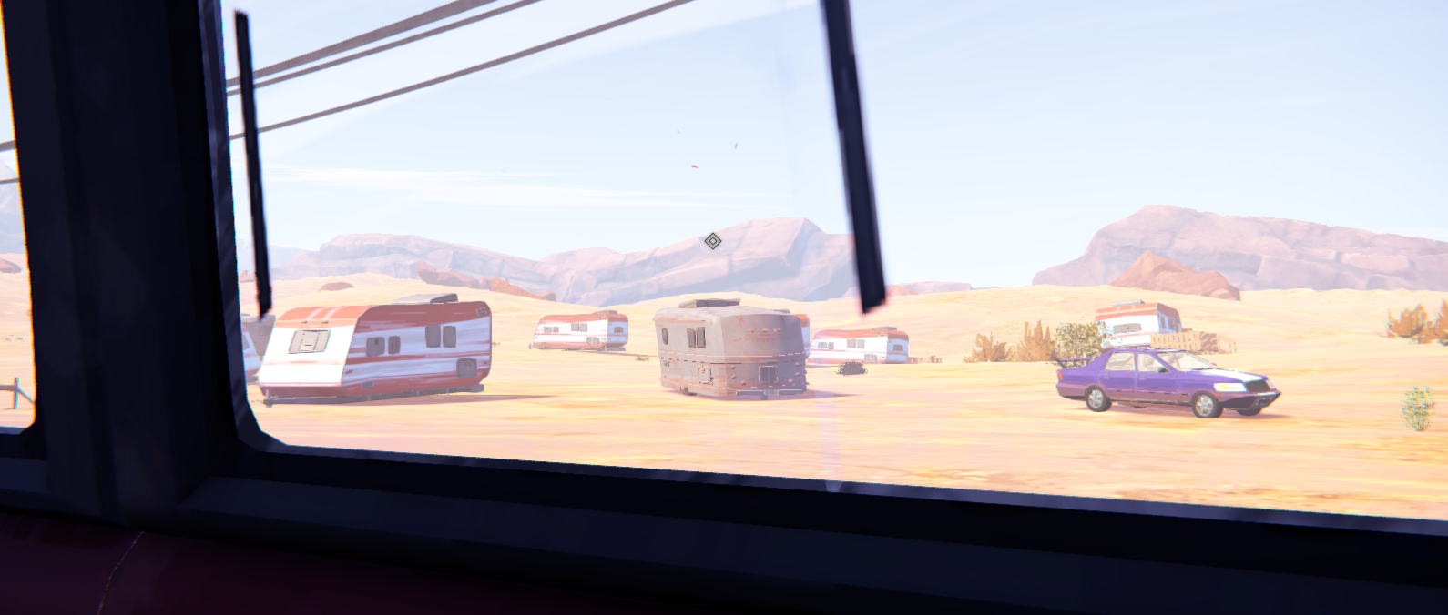 View from inside a vehicle showing several RVs and a purple car in a desert landscape.