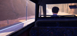 A view from the back seat of a bus, looking out at a winding road and rocky cliffs.