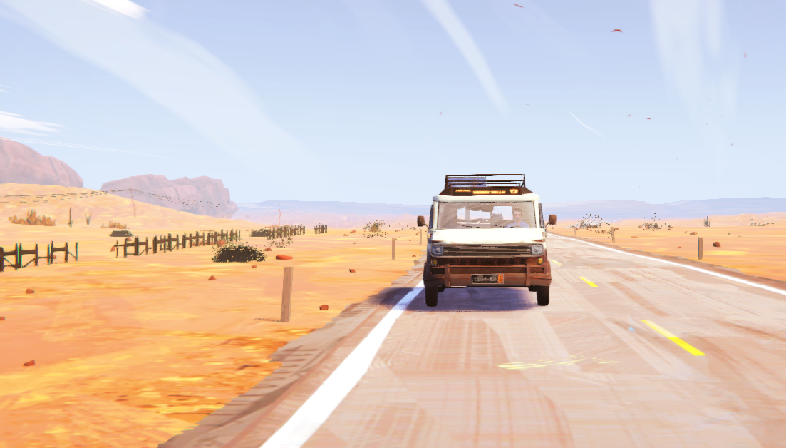 A van driving on a deserted road in a desert landscape.