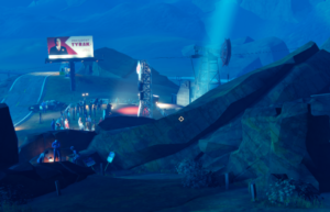 A nighttime scene from the game Road 96, featuring a crowd gathered near a billboard and stage in a mountainous area.