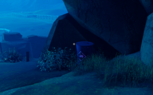 A blue-toned scene from the game Road 96, featuring a barrel near a rock and some grass.