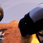 Close-up of two characters wearing masks and armor in a desert setting.