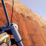 Screenshot from the game Road 96 showing a view of rocky terrain with sparse vegetation and a distant figure.