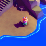 A small fox character stands on a beach near blue water with stairs leading up a rocky area.