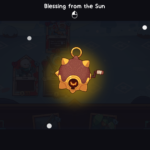 Screenshot from the game Wildfrost, displaying an item called "Blessing from the Sun" with a glowing sun-themed icon and cards in the background.